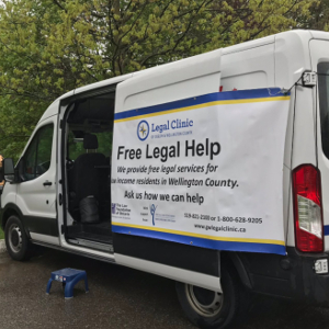 Photo of white van with the words "Free Legal Help" written on the side