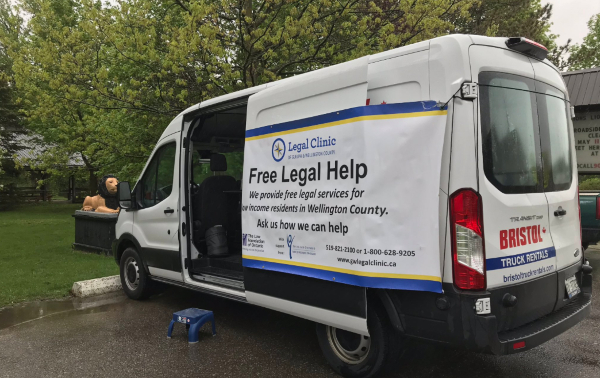 Photo of white van with "Free Legal Help" written on the side