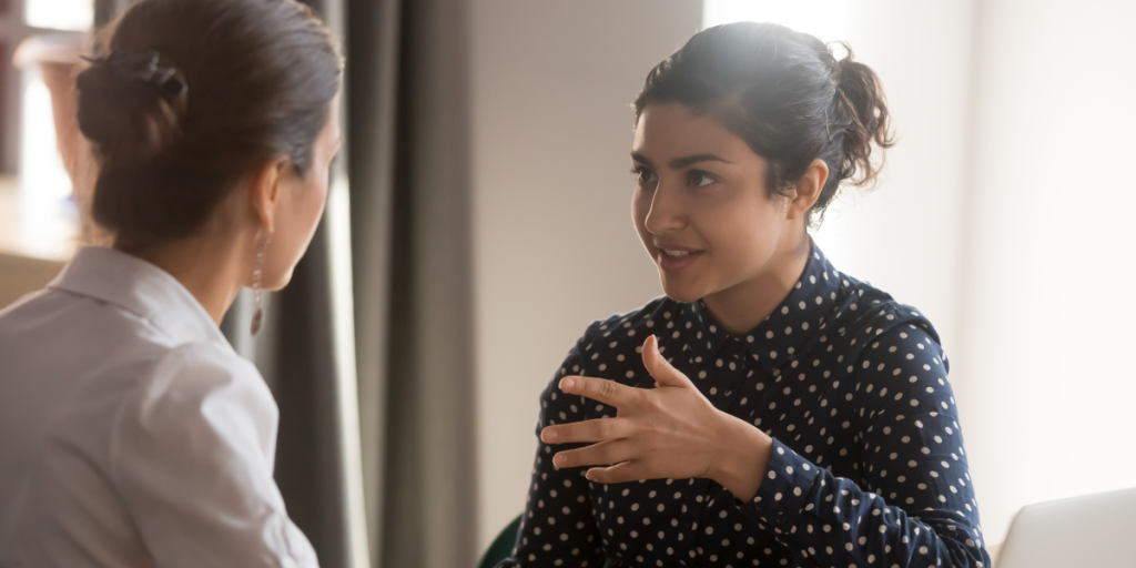 Two young women talking