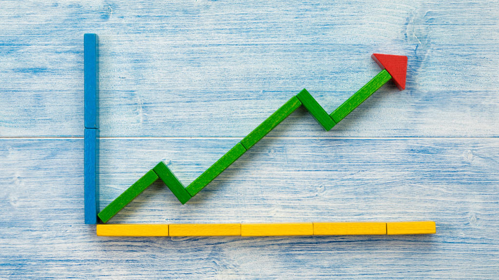 coloured blocks in the shape of a line graph with an arrow trending up