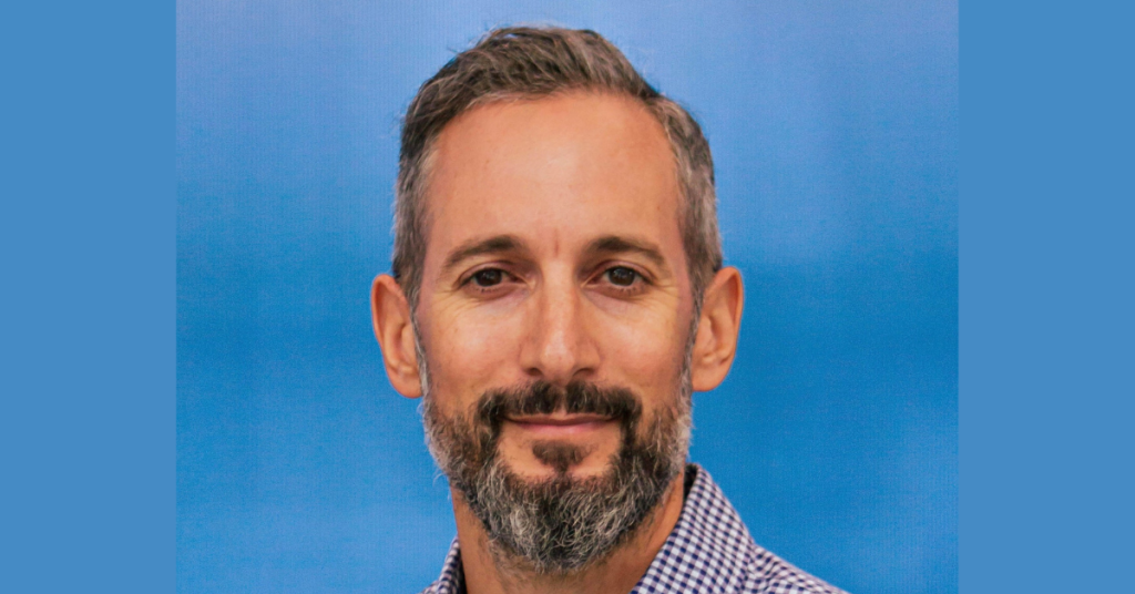 Man with short salt and pepper coloured hair and beard